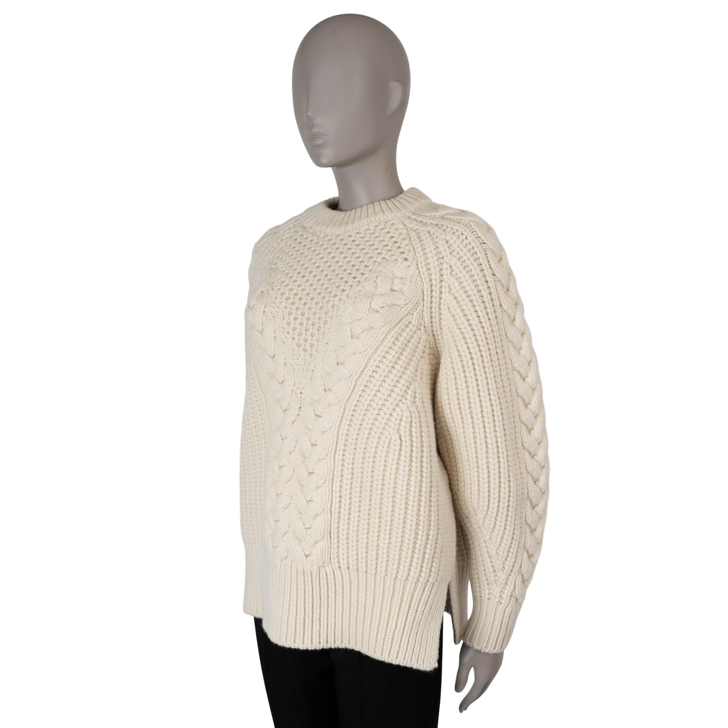 This 100% authentic Alexander McQueen chunky patchwork knit sweater is crafted from cream wool (100%) and features a boxy, oversized silhouette. The design combines a mix of cable and rib-knit textures, complemented by a crewneck, rib-knit trims,