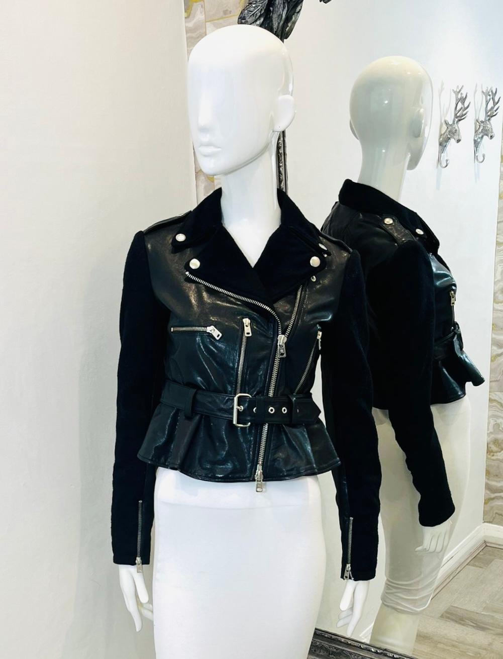 Alexander McQueen Cropped Peplum Leather & Wool Biker Jacket

Black biker jacket designed with peplum hem and belted waist.

Featuring cropped fit, asymmetric zip closure and three zipped pockets to the front.

Detailed with fabric long sleeves with