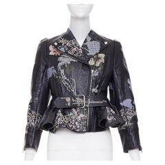 ALEXANDER MCQUEEN Giacca moto in pelle con ricamo a punto croce e peplo floreale IT40 S
