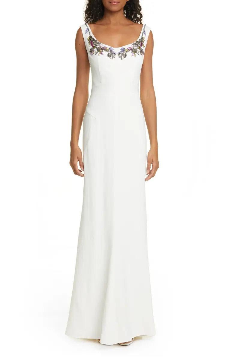 Embellished Neck Crepe Sheath Gown by Alexander McQueen
Embroidered blooms sparked with beads grace the face-framing neckline on this beautifully constructed column gown.
60
