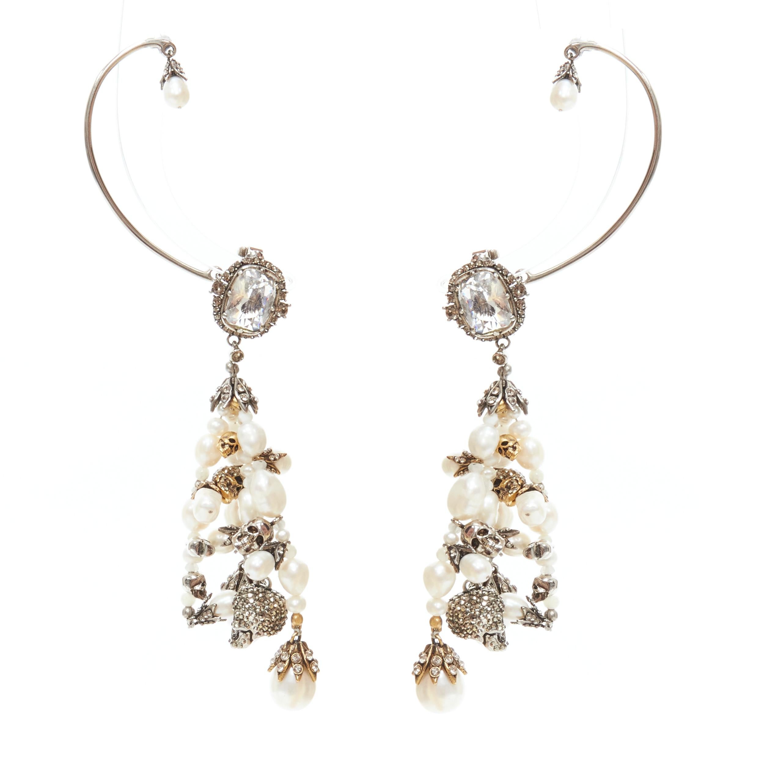 ALEXANDER MCQUEEN crystal jewel pearl bead crystal skull cuff dangling earring 
Reference: KEDG/A00005 
Brand: Alexander McQueen 
Designer: Sarah Burton 
Material: Metal 
Color: White 
Pattern: Solid 
Closure: Screw Back 
Extra Detail: Rhinestone