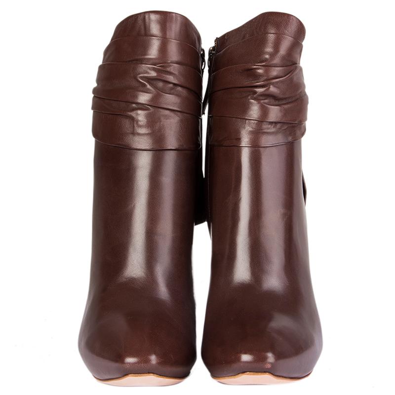 100% authentic Alexander McQueen pleated ankle-boots in dark brown leather with bow detail on the back. Hidden platform. Open with a zipper on the inside. Brand new. Come with dust-bag. 

Measurements
Imprinted Size	39.5
Shoe Size	39.5
Inside