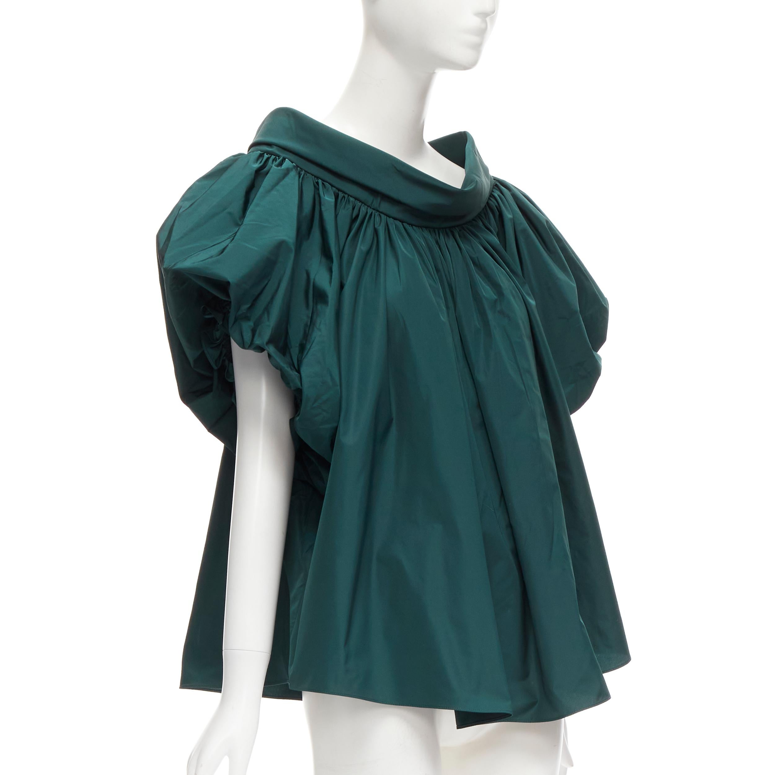 ALEXANDER MCQUEEN dark green puff sleeve bateau high collar flare top IT38 XS
Reference: AAWC/A00396
Brand: Alexander McQueen
Designer: Sarah Burton
Material: Polyester
Color: Green
Pattern: Solid
Closure: Pullover
Made in: