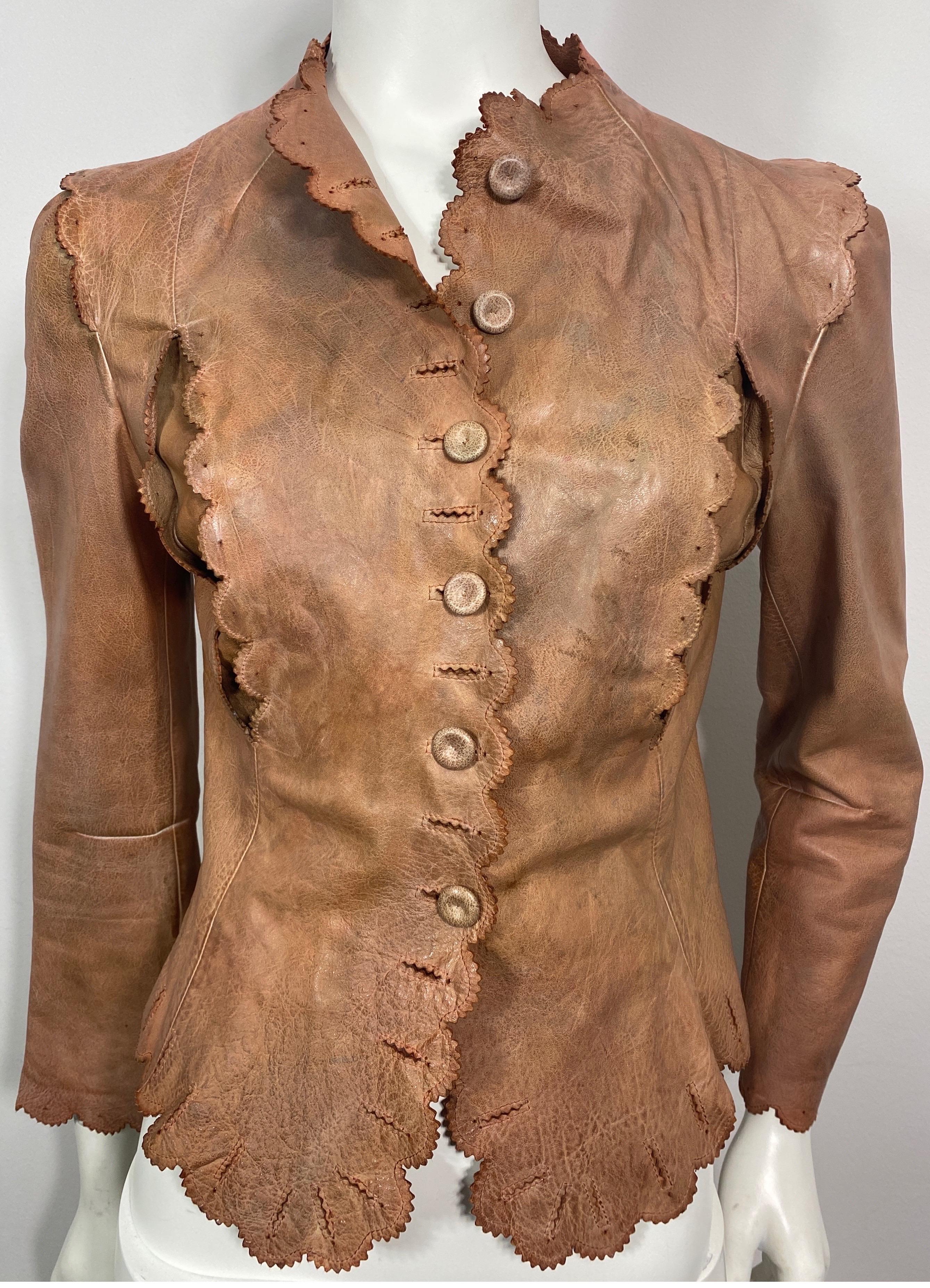 Alexander McQueen Dark Nude Distressed Leather Jacket-Size 40. This distressed leather jacket is in a dark nude color with certain areas being darker than others, the jacket has scalloped edges to it throughout with some inserts that have the same