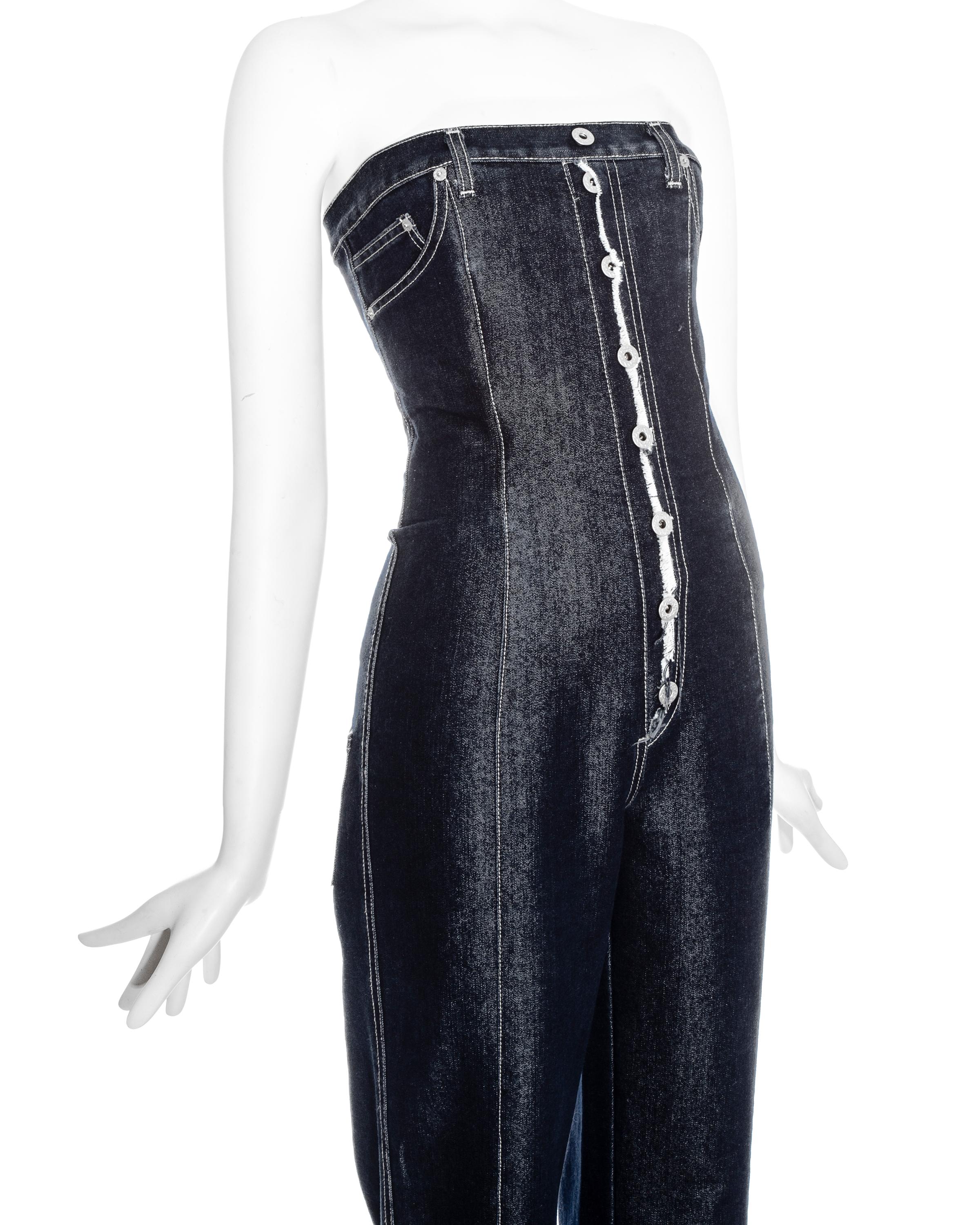 Vintage Alexander McQueen denim corset jumpsuit.
One of his earliest collections when Alexander McQueen himself was the designer and had a denim line. This piece was shown at London Fashion Week.
Corset inside.