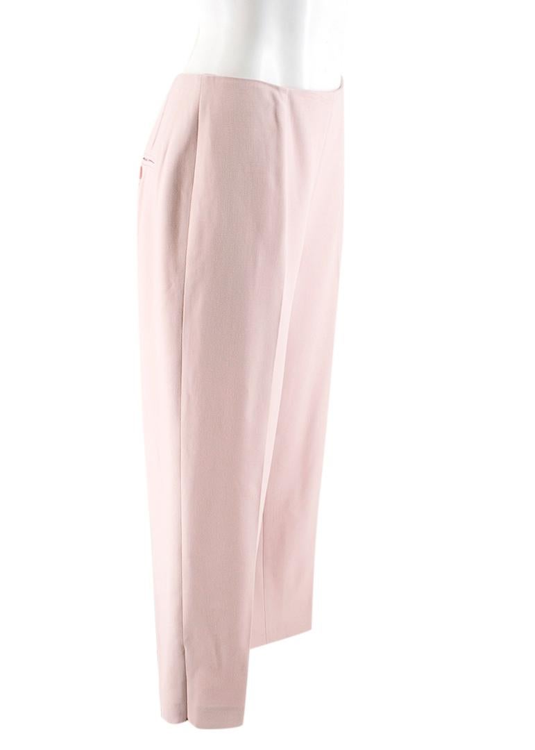 Alexander McQueen Dusty Pink Wool Trousers

- Dust pink trousers 
- Straight leg
- Hidden zip fastening to the middle back 
- One slip pocket to the back
- Unlined
- Zip fastening detail to the bottom of the leg 12.5cm
Please note, these items are