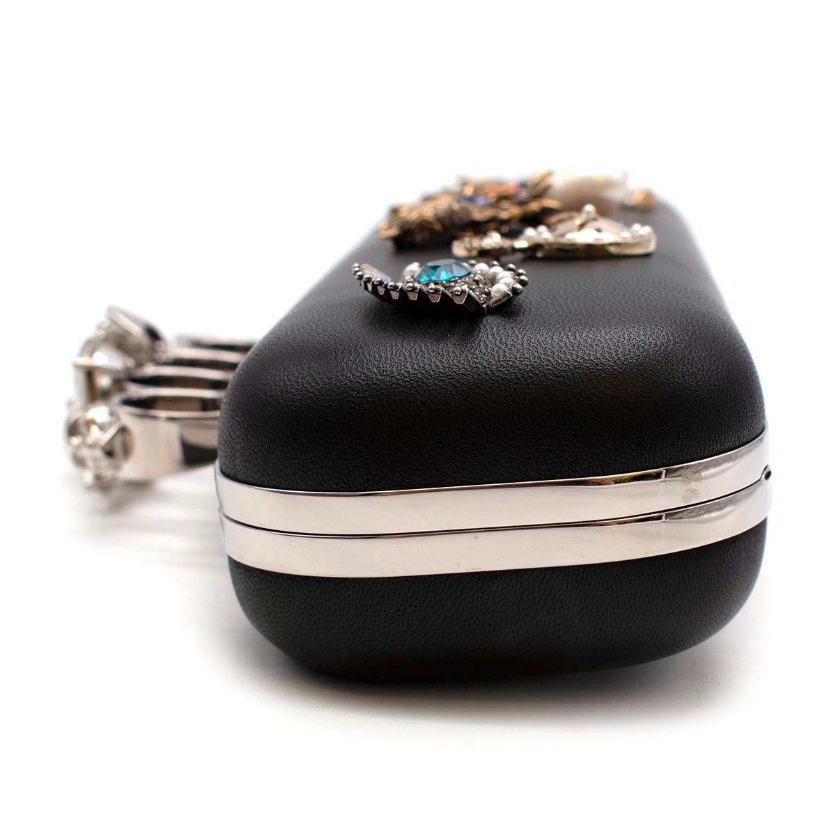 Black Alexander McQueen embellished black leather four-ring clutch bag