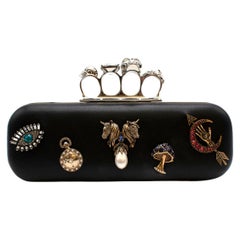 Alexander McQueen embellished black leather four-ring clutch bag 