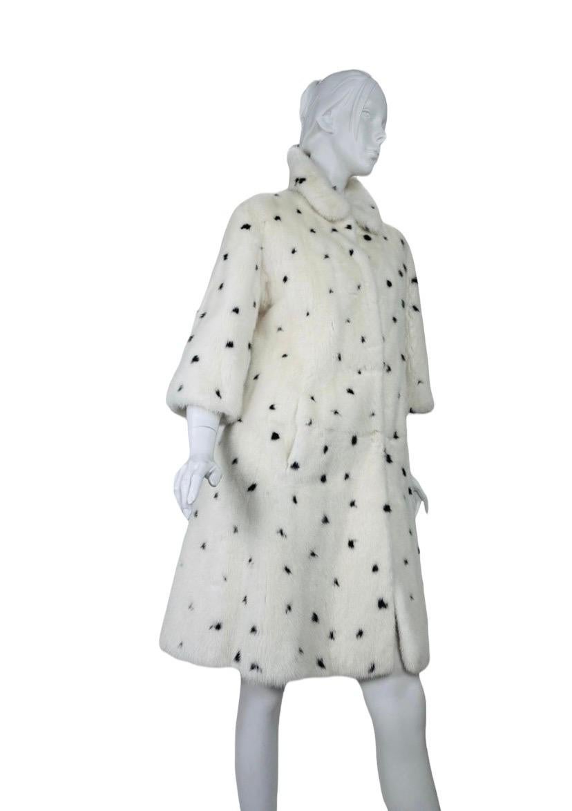  Alexander McQueen Mink Fur White Black Coat
F/W 2008 Runway Collection
IT 40 - US  4/6
Content: 100% Mink Fur, A-Line Style, Knee Length, Two Side Pockets, Black Silk Lining, Hooks Closure.
Measurements: Length 39 inches , Shoulders 19