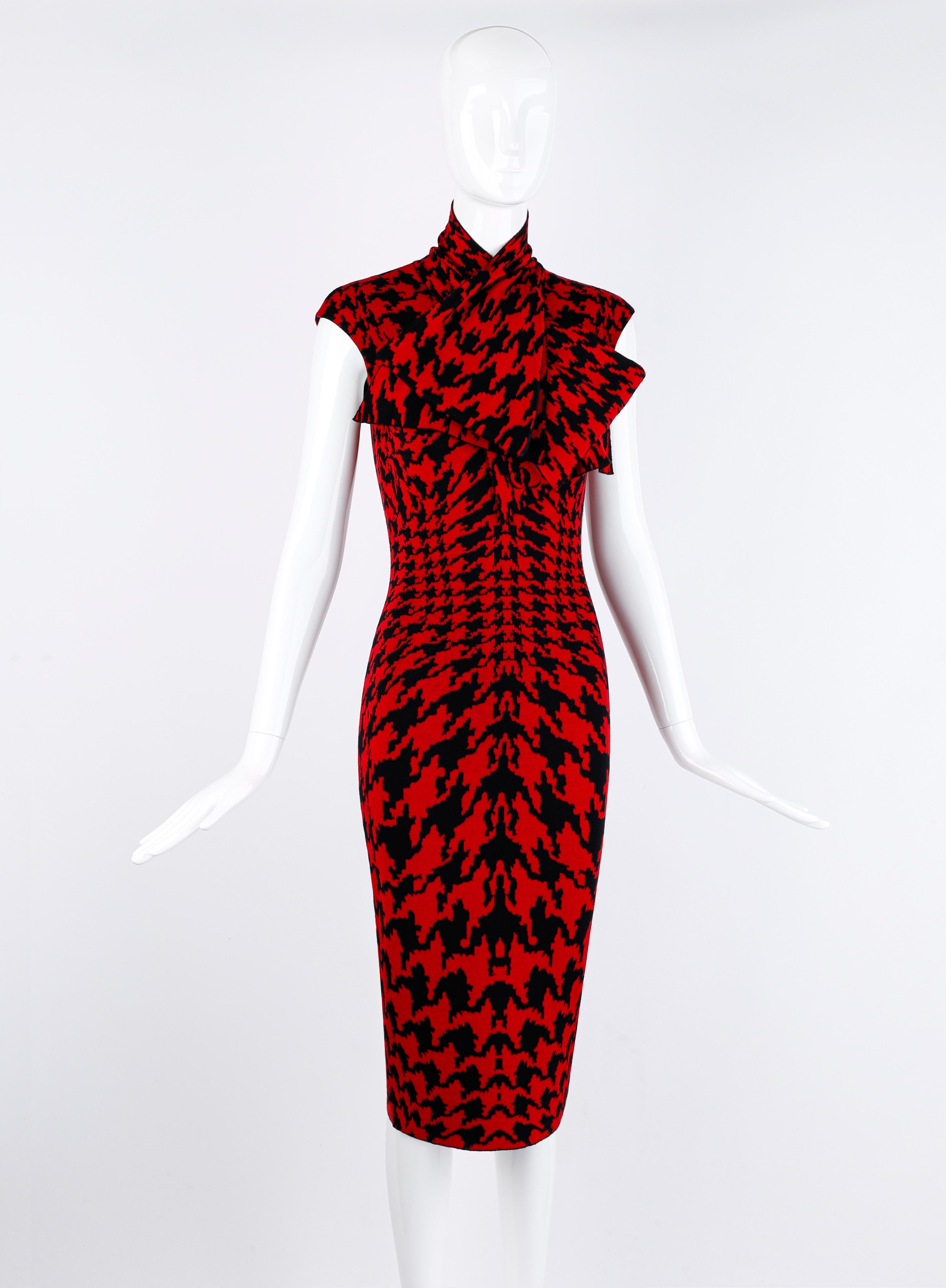 Designed by Alexander McQueen for the fall/winter 2009 collection. Red and black knit houndstooth pattern, in varied sizes to accentuate the figure. Sleeveless, form-fitting. Material has some stretch to it. Oversized bow at neckline. Bow can be