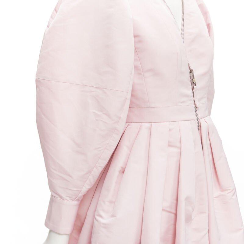 ALEXANDER MCQUEEN faille light pink ballon sleeve technical dress IT38 XS
Reference: AAWC/A00174
Brand: Alexander McQueen
Designer: Sarah Burton
Collection: 2021
Material: Polyester
Color: Pink
Pattern: Solid
Closure: Zip
Lining:  Unlined
Extra