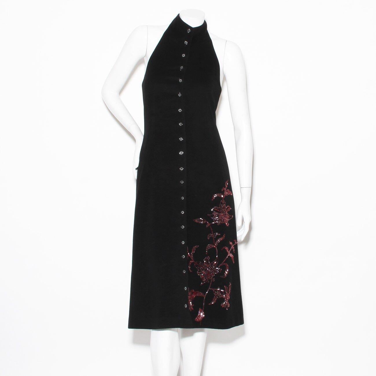 Product Details:
Wool beaded dress by Alexander McQueen
Fall 1998 Joan Collection
Black wool exterior 
Halter top high neck 
Open back 
Button down front 
Red floral print beading at bottom 
Red lining with Mqueen logo  printed 
Made in