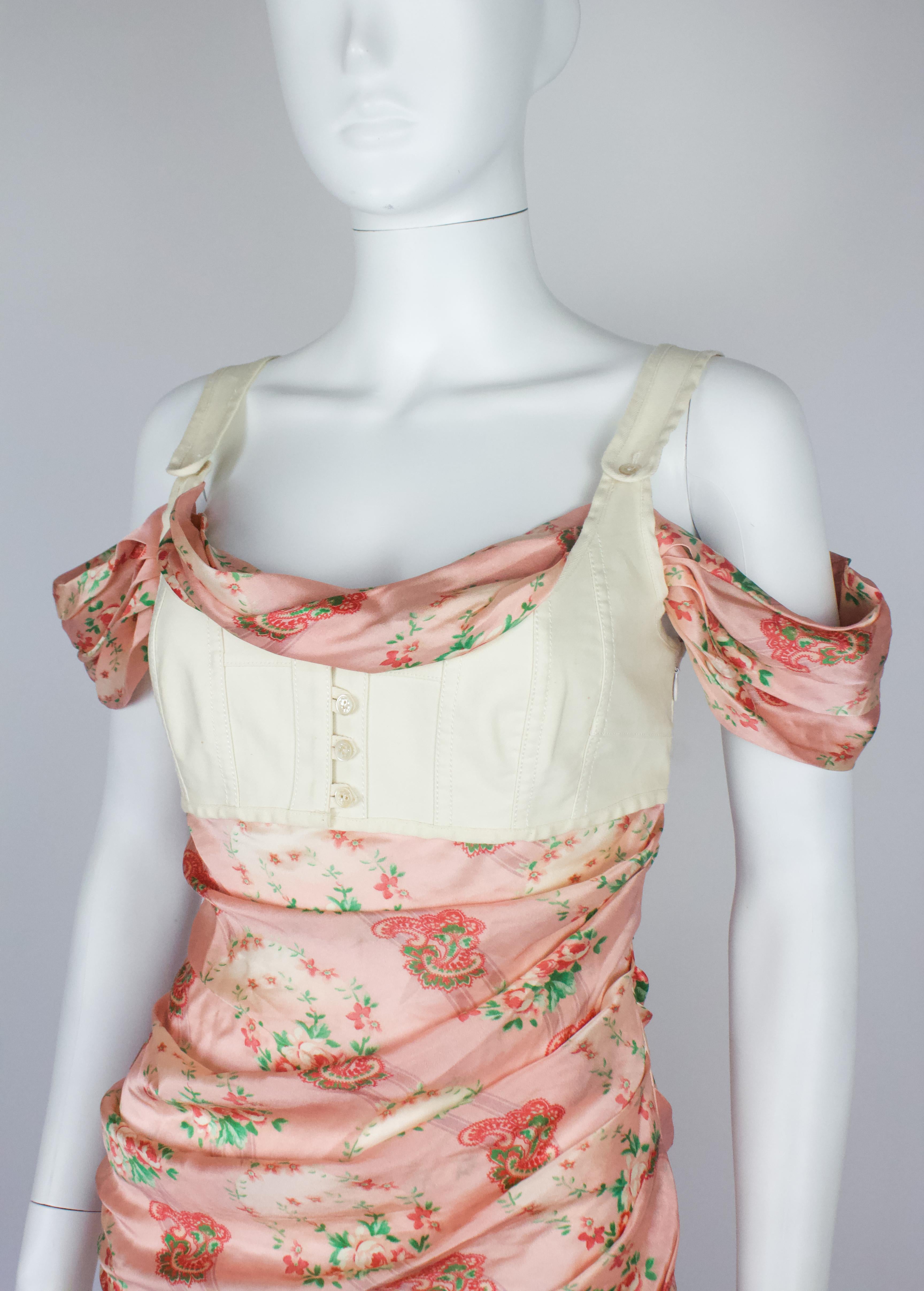 Alexander McQueen top from the Spring/Summer 2005 'It's Only a Game' collection. Floral silk, with an integrated cotton corset style bodice, draped sleeves and ruching detail. Similar pieces with the outer layered bodice seen on the