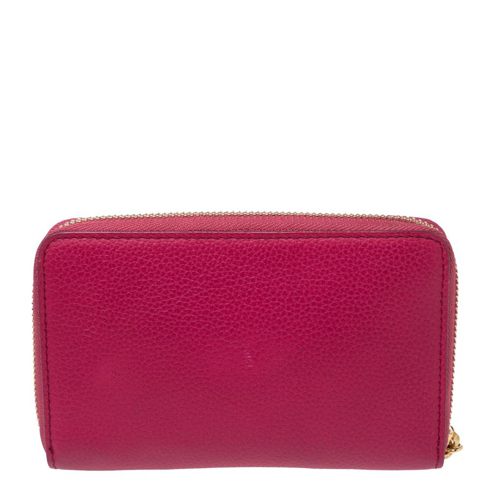 The durable leather design of this wallet makes it a durable accessory. This fine wallet features a fuchsia shade and a zipper to secure the well-equipped interior. This Alexander McQueen creation can easily fit into your everyday bags.

Includes: