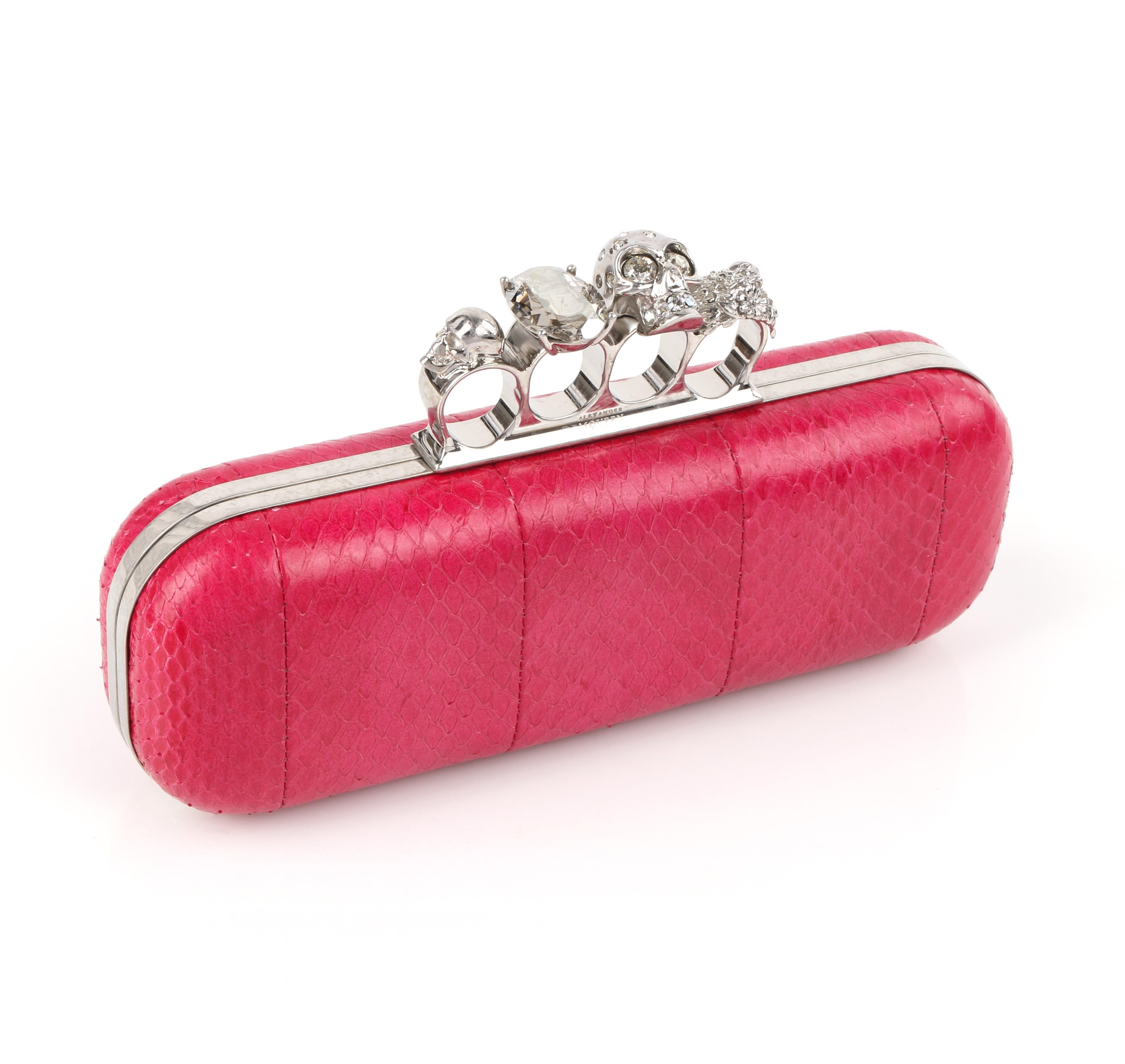 DESCRIPTION: ALEXANDER McQUEEN Fuchsia Pink Python Knuckle-Duster Box Clutch
 
Estimated Retail: $2,545
 
Brand / Manufacturer: Alexander McQueen
Style: Clutch
Color(s): Shades of pink
Lined: Yes
Unmarked Fabric Content (feel of): Python /