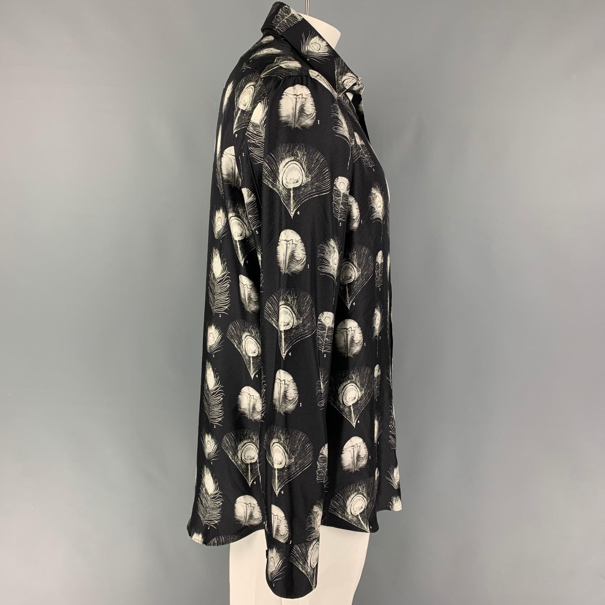 ALEXANDER McQUEEN Fall-Winter 2017 long sleeve shirt comes in a black & white print silk featuring a spread collar and a button up closure. Made in Italy.
Excellent
Pre-Owned Condition. 

Marked:   17+ 

Measurements: 
 
Shoulder:
20 inches  Chest: