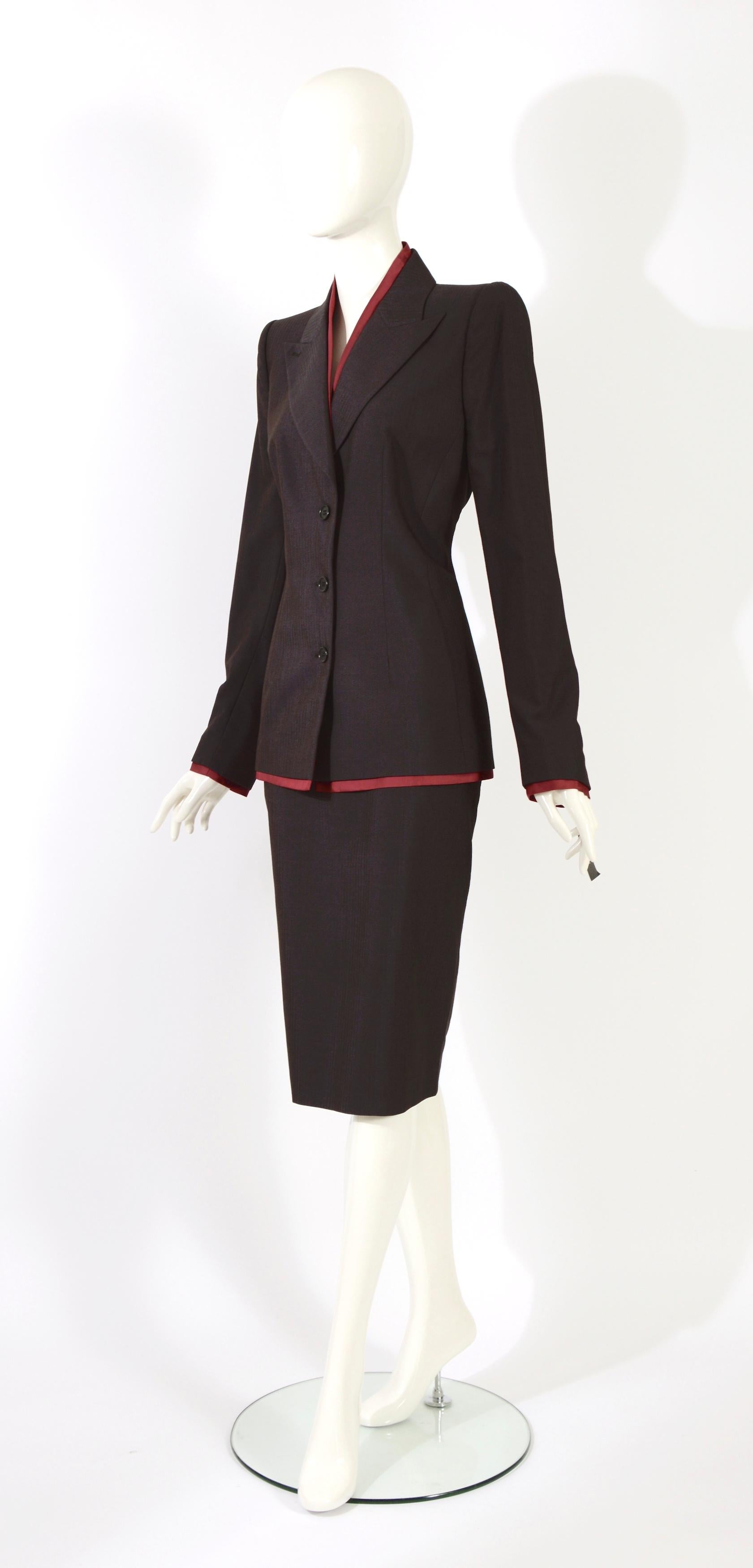 Important collectible Alexander McQueen Fall Winter 1997 'It's a Jungle Out There' collection pinstripe jacket and skirt suit. 
Runway look, the jacket has shoulder pads. 
The condition is unworn with tags still attached. 
Made in Italy 
Jacket and