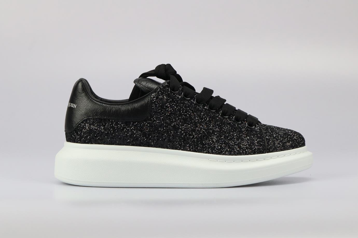 Alexander Mcqueen Glittered Leather Platform Sneakers. Black and white. Lace up fastening - Front. Comes with - extra laces. EU 40 (UK 7, US 10). Insole: 11.3 in. Heel height: 1.7 in. Platform: 1.7 in. Condition: New without box.