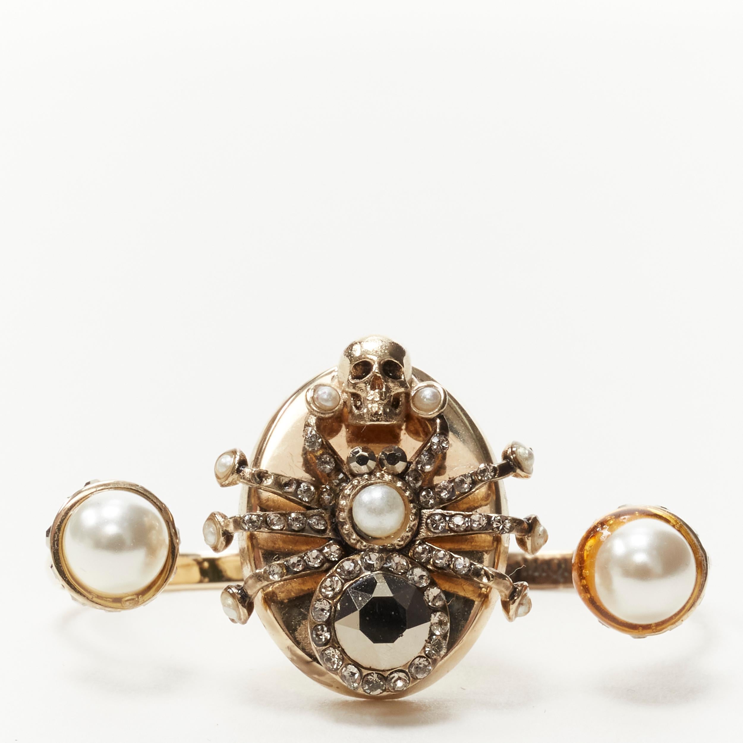 ALEXANDER MCQUEEN gold crystal Spider punk skull pearl double ring 
Reference: KEDG/A00020 
Brand: Alexander McQueen 
Material: MEtal 
Color: Gold 
Pattern: Solid Extra 
Detail: Adjustable sizing 
Made in: Italy 

CONDITION: 
Condition: Excellent,