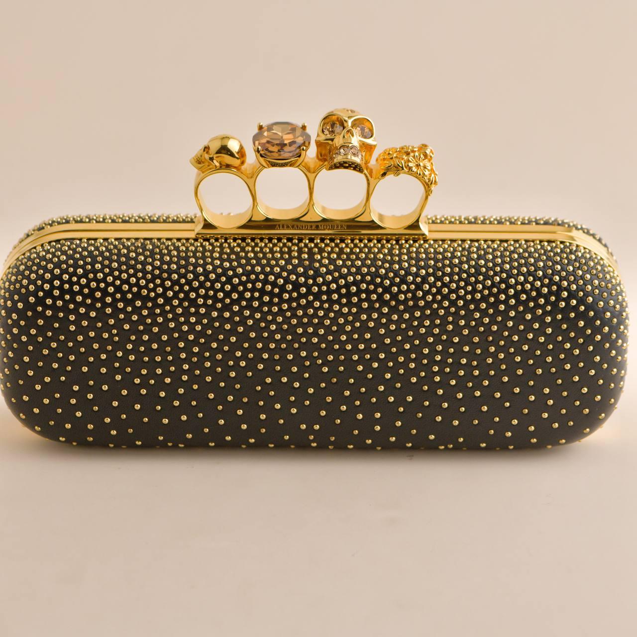 SKU	CT-2437
Comes With	Dandelion Authenticity Guarantee Card Only
Model	Knuckle Clutch
Metal	Gilt
Length	approx 24 cm
Width	approx 5 cm
Condition	Excellent
Other Info	Left to Right: approx 24cm / Height: approx 8cm / Depth: approx