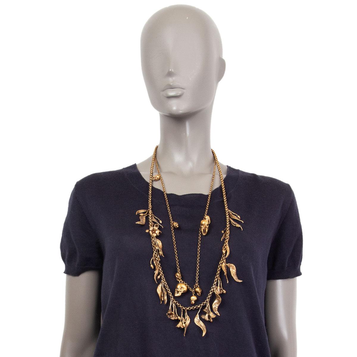 Alexander McQueen double chain necklace in gold-tone brass with skull charms on one and flower charms on the other chain. Has been worn and is in excellent condition.

Width 5cm (2in)
Length 84cm (32.8in)
