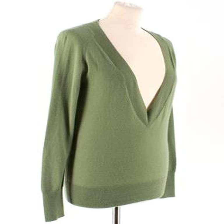 Alexander McQueen Green Deep V Neck Knit Top

-Green long sleeve top
-Deep V Neck
-Ribbed neckline, cuffs and hemline

Please note, these items are pre-owned and may show signs of being stored even when unworn and unused. This is reflected within