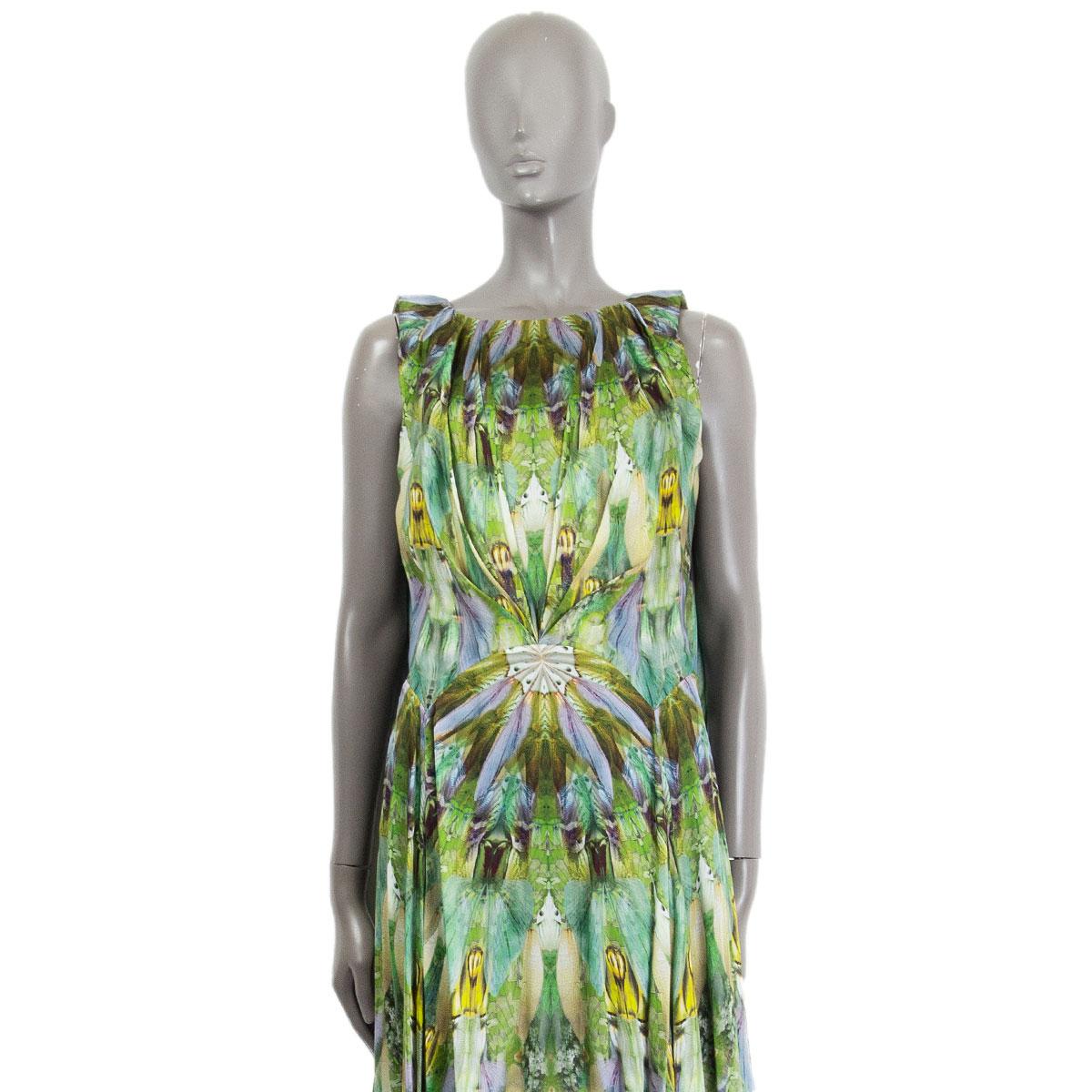 Alexander McQueen 'Praying Mantis' empire down in green silk (100%) with a round neck and is sleeveless. This collector piece is from the SS 2010 Platos Atlantis collection. Flares from the back to the sides which gives the dress a whimsical