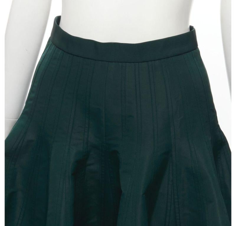 ALEXANDER MCQUEEN green taffeta top stitching panelled flared midi skirt IT36 XS
Reference: AAWC/A00393
Brand: Alexander McQueen
Designer: Sarah Burton
Material: Polyester
Color: Green
Pattern: Solid
Closure: Zip
Lining: Fabric
Made in: