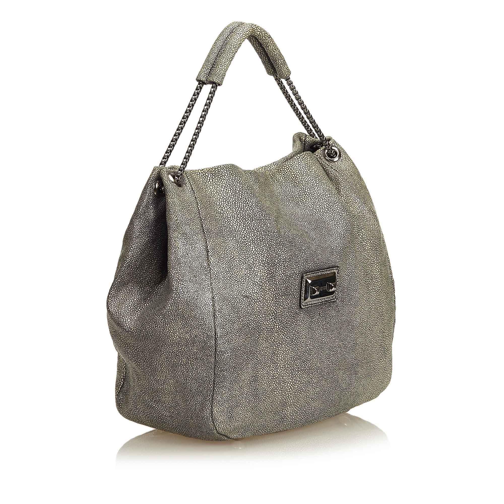 This hoboh bag features a textured leather body, silver tone chain straps, open top, and interior slip pocket. It carries as B+ condition rating.

Inclusions: 
Dust Bag

Dimensions:
Length: 35.00 cm
Width: 42.00 cm
Depth: 16.00 cm
Hand Drop: 12.00