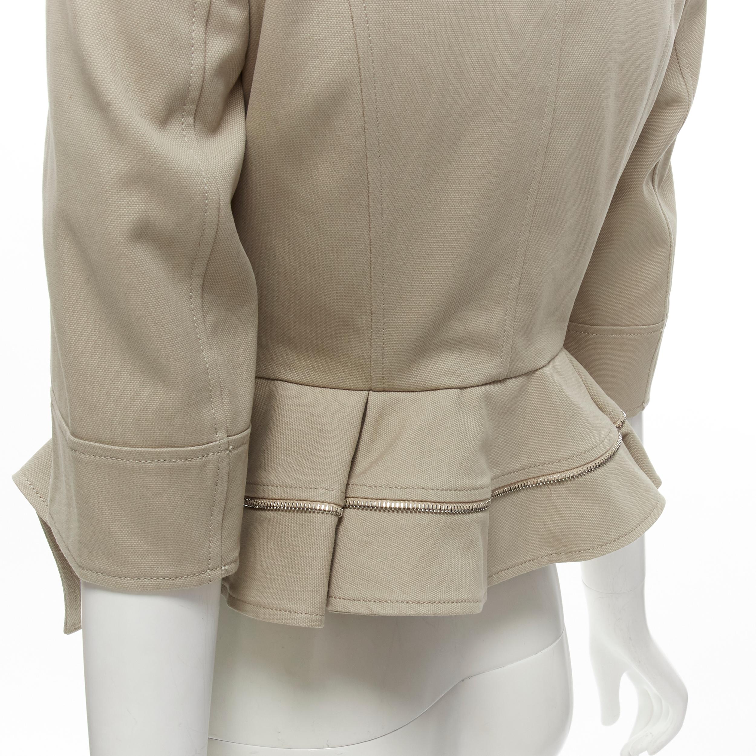 ALEXANDER MCQUEEN grey cotton fitted zipper trim peplum utility jacket IT38 XS
Brand: Alexander McQueen
Material: Cotton
Color: Grey
Pattern: Solid
Closure: Button
Extra Detail: Utility inspired flap pocket and shoulder epaulette. Silver-tone