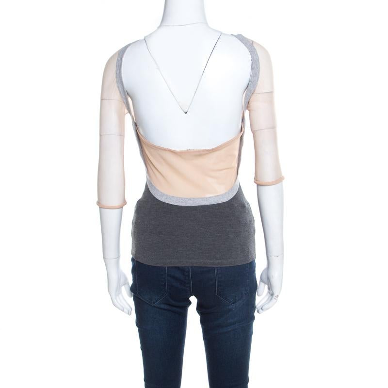 Look casual and cool by pairing this classic Alexander McQueen top with any bottoms of your choice. This eye-catching grey top has mesh inserts and a plunging back.

Includes: The Luxury Closet Packaging

The Luxury Closet is an elite luxury