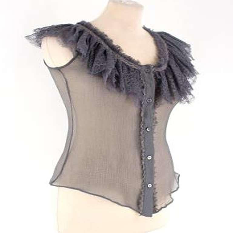 Alexander McQueen Grey Lace Ruffled Top

-Sleeveless top with lace ruffled collar
-Sheer top
-Button down with two poppers

Please note, these items are pre-owned and may show signs of being stored even when unworn and unused. This is reflected