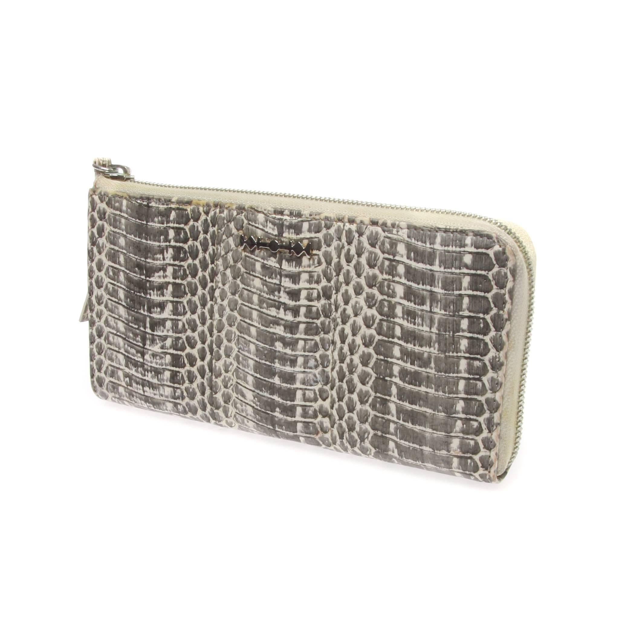 	
Alexander McQueen Grey Python Purse
Simple but handy for daily use.
Features a Zipped closure which allows for better organisation.
Colour: Grey and Off White
Hardware: Silver
Closure/Opening: Zip 