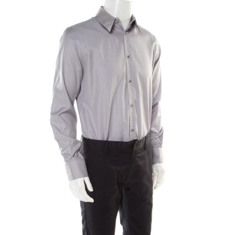 You'll love to wear this Alexander McQueen shirt as it is well-tailored. The creation is made of cotton and features long sleeves, front buttons, and a collar with eyelets. You can pair it with trousers and leather shoes.

Includes: The Luxury