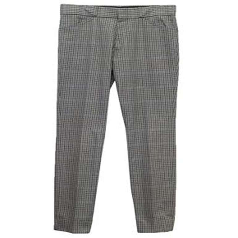 Alexander McQueen Grey Check Trousers. 

There is a small hole on the side of the left pocket and no care label. Please see zoomed pictures for more details. 

Condition: 8/10.