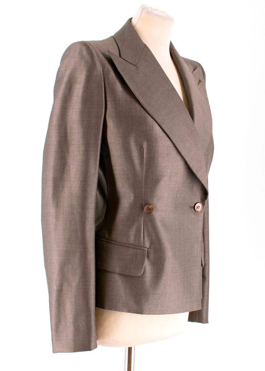 Alexander McQueen Grey Wool and Silk Suit

-Grey suit comprising of blazer and trousers

Blazer:
-Grey double breasted blazer
-Tailored around the waist
-Two front pockets
-Shoulder pads
-Buttons on the cuffs

Trousers:
-Grey trousers with zip and