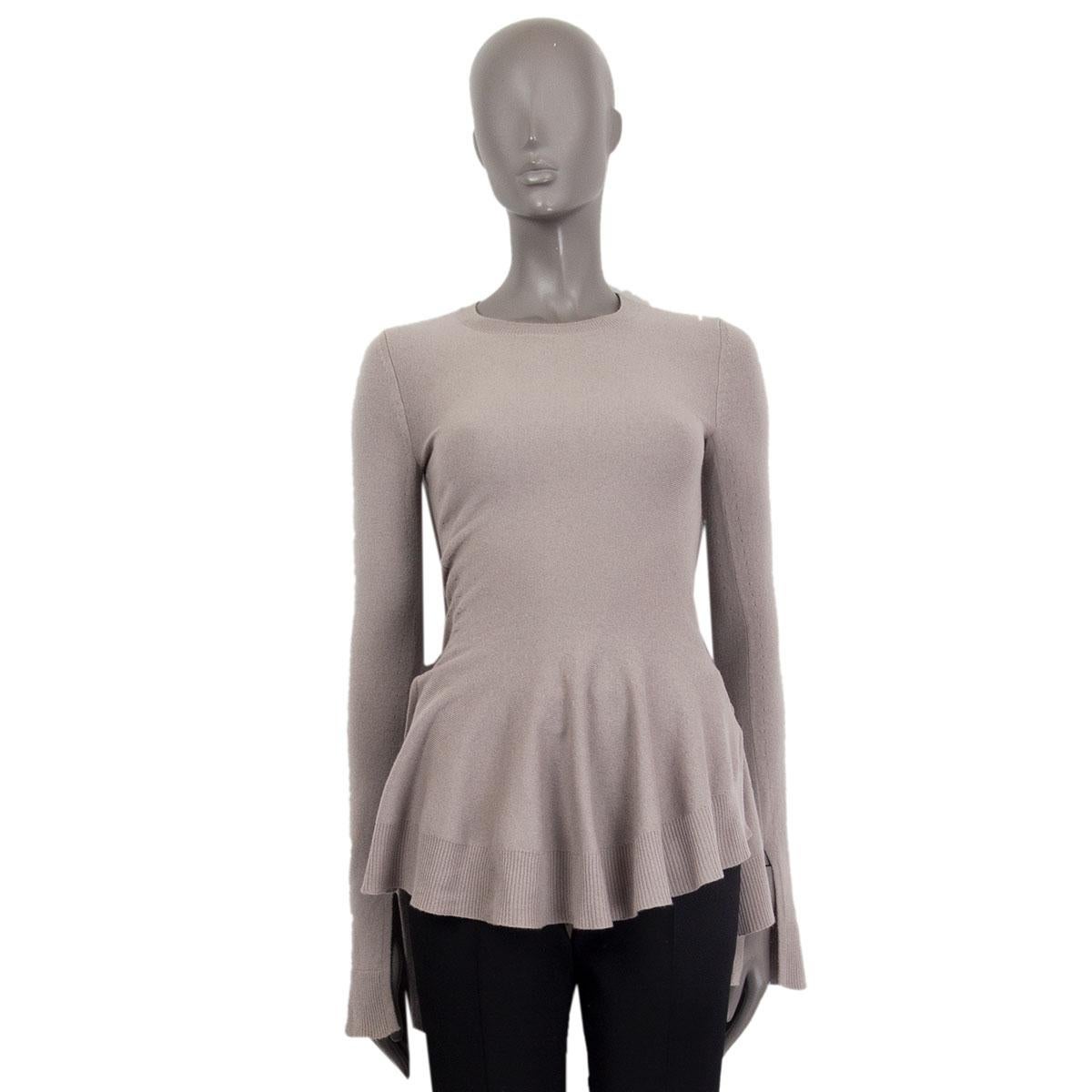Alexander McQueen crew-neck sweater in taupe wool (70%) and cashmere (30%) with a flared bottom and two slits on the side. Has been worn and is in excellent condition. 

Tag Size XS 
Size XS
Shoulder Width 35cm (13.7in)
Bust 38cm (14.8in)
Waist 66cm