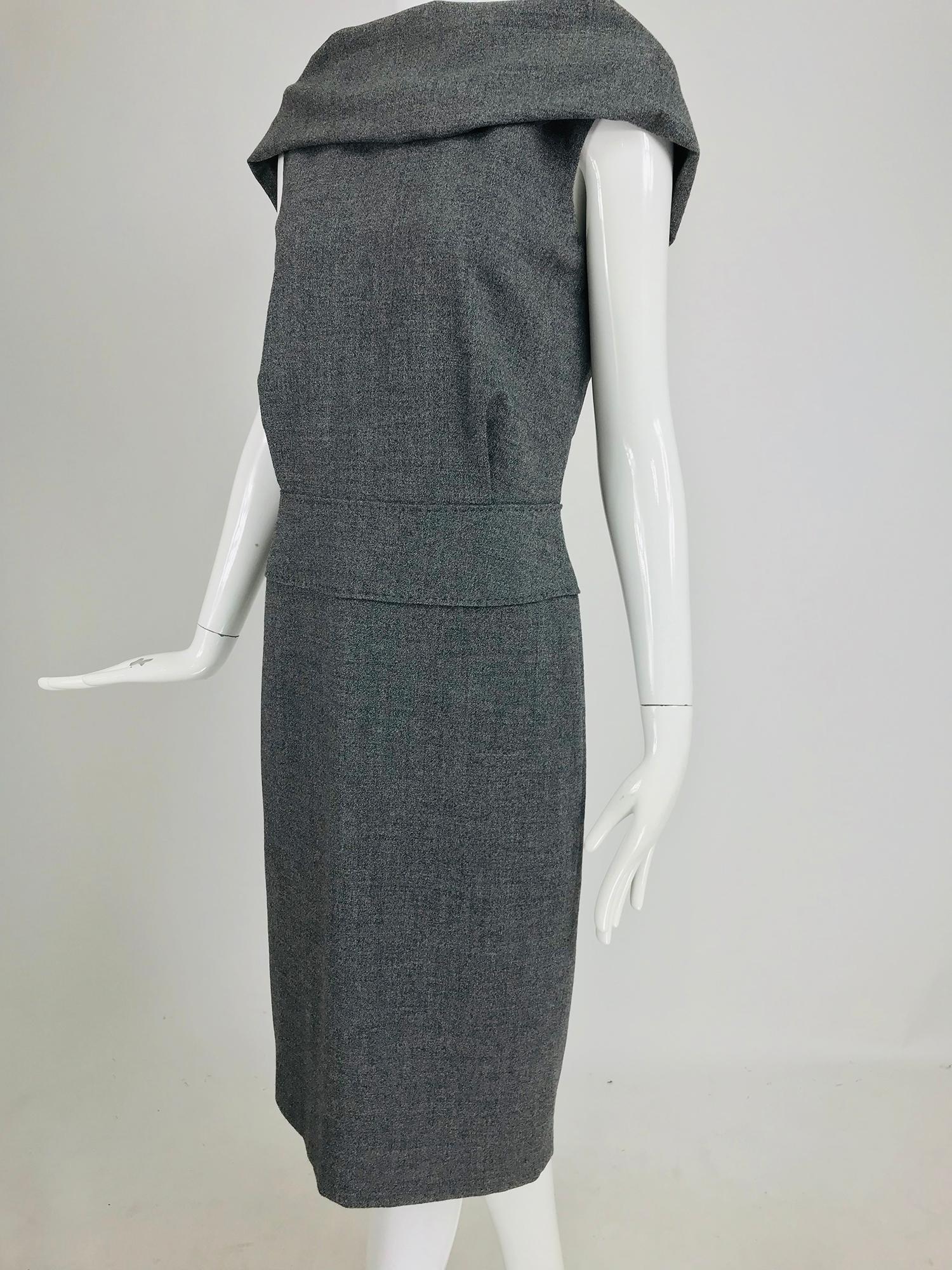 Alexander McQueen Grey Wool V Back Fitted Sheath Dress. This chic little dress has lots of great details going for it like the draped cowl neckline at the front and the deep V back. I especially like the shaped band at the hip with it's hand done