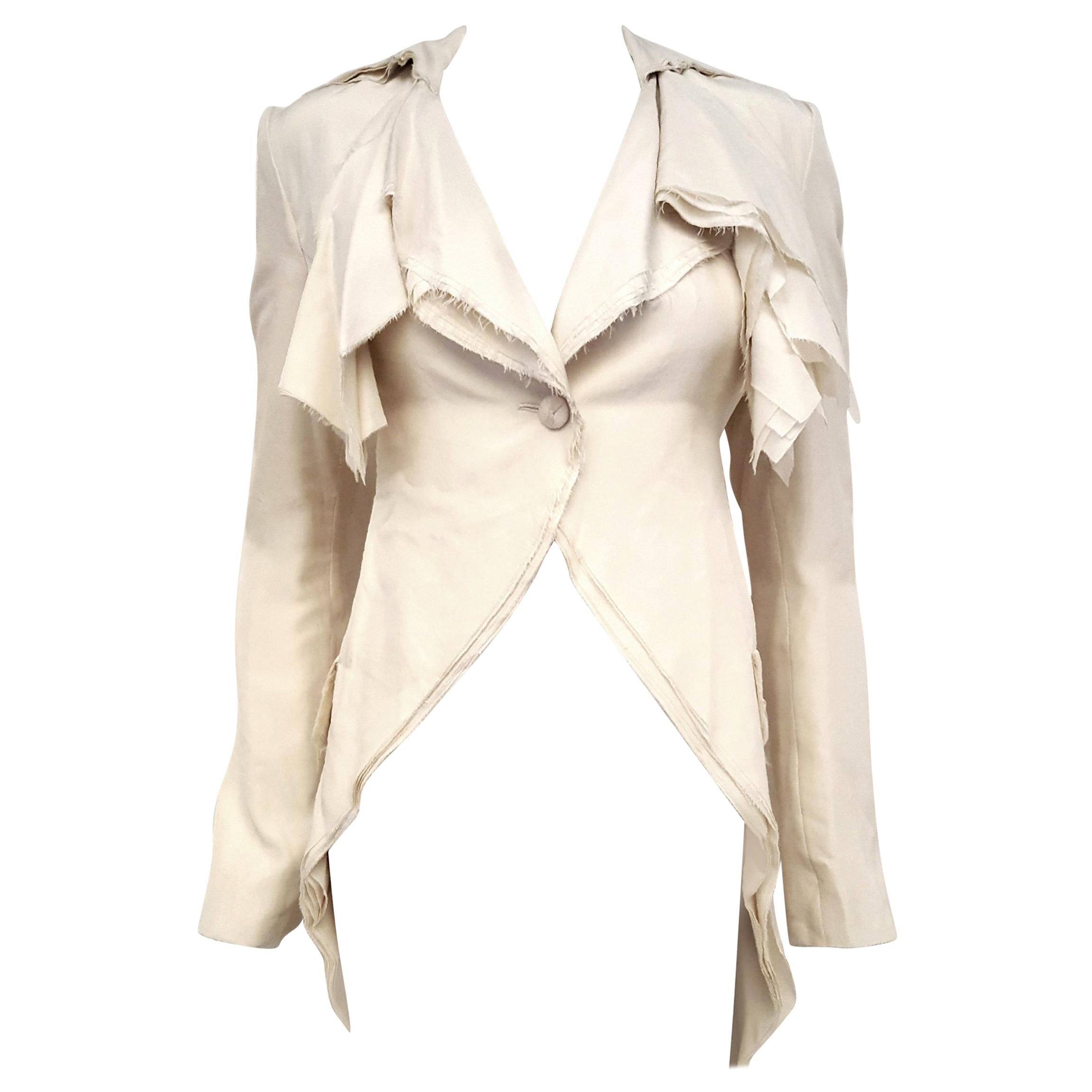 Alexander McQueen Habotai silk winter white coat is a stunning display of signature craftsmanship.  It is composed from ten layers of silk-habotai with frayed edges!  Yes, we said 10 layers of soft, self indulgent silk, making it a striking coverup