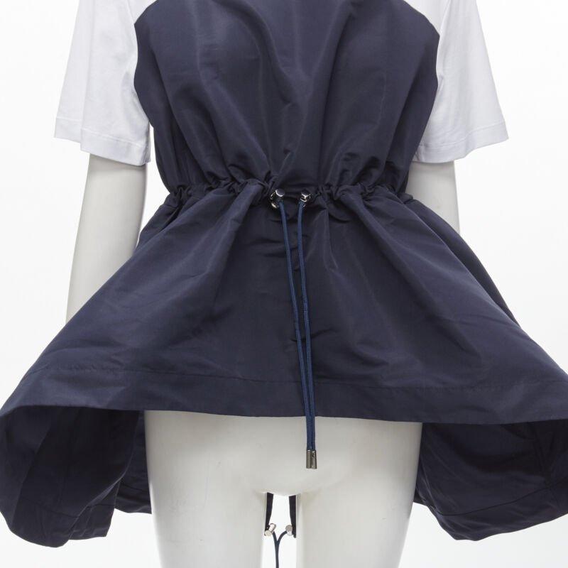 ALEXANDER MCQUEEN Hybrid navy drawstring high low white tshirt IT38 XS
Reference: AAWC/A00088
Brand: Alexander McQueen
Material: Cotton, Nylon
Color: White, Navy
Pattern: Solid
Closure: Drawstring
Extra Details: Drawsrting toggle waist. High low