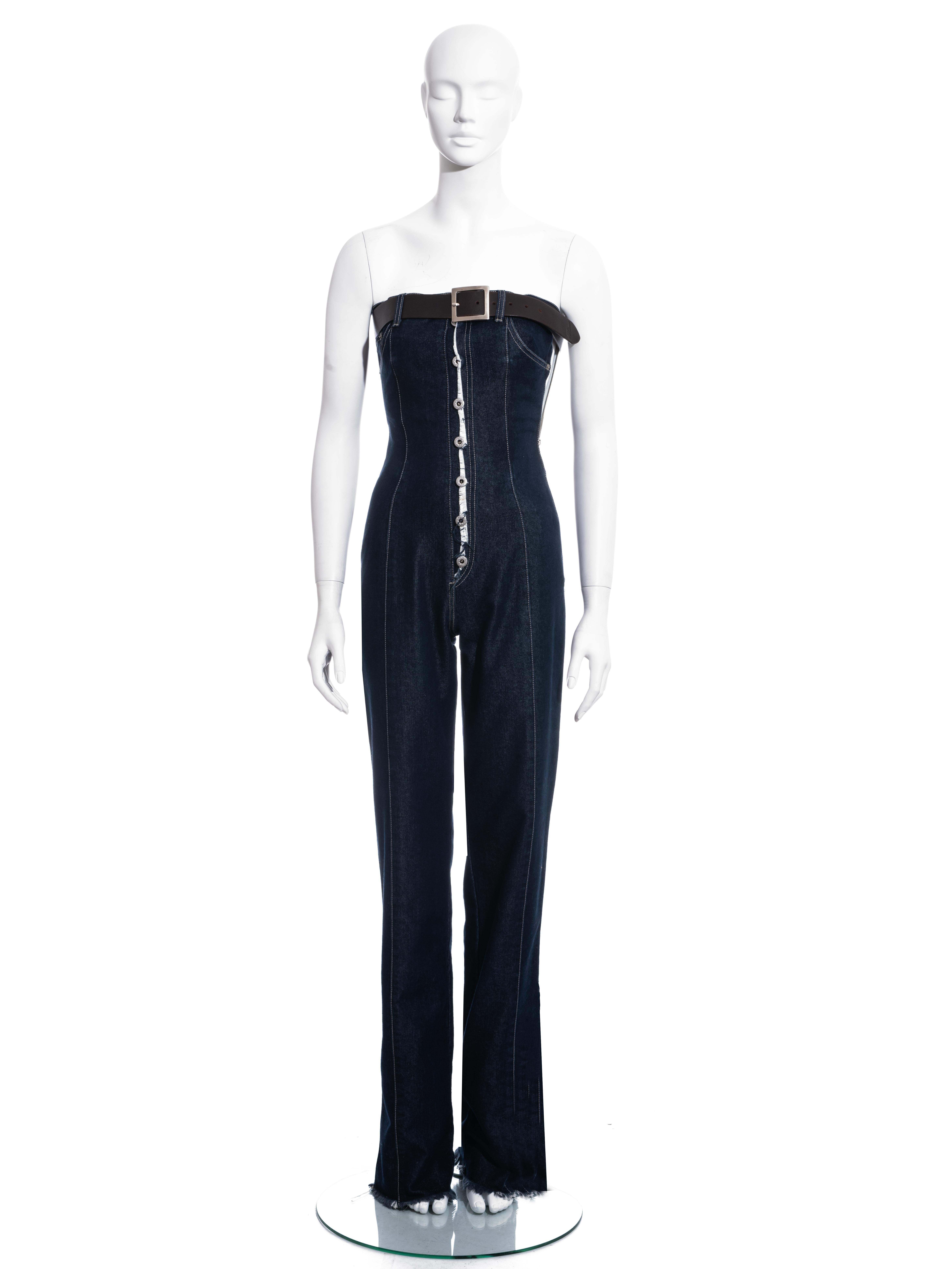 ▪ Alexander McQueen indigo denim corseted jumpsuit
▪ 64% Cotton, 36% Polyester
▪ Metal button and zip fastening 
▪ Brown leather belt with metal buckle 
▪ Straight leg
▪ Frayed edges 
▪ IT 40 - FR 36 - UK 8 - US 4
▪ Fall-Winter 1996