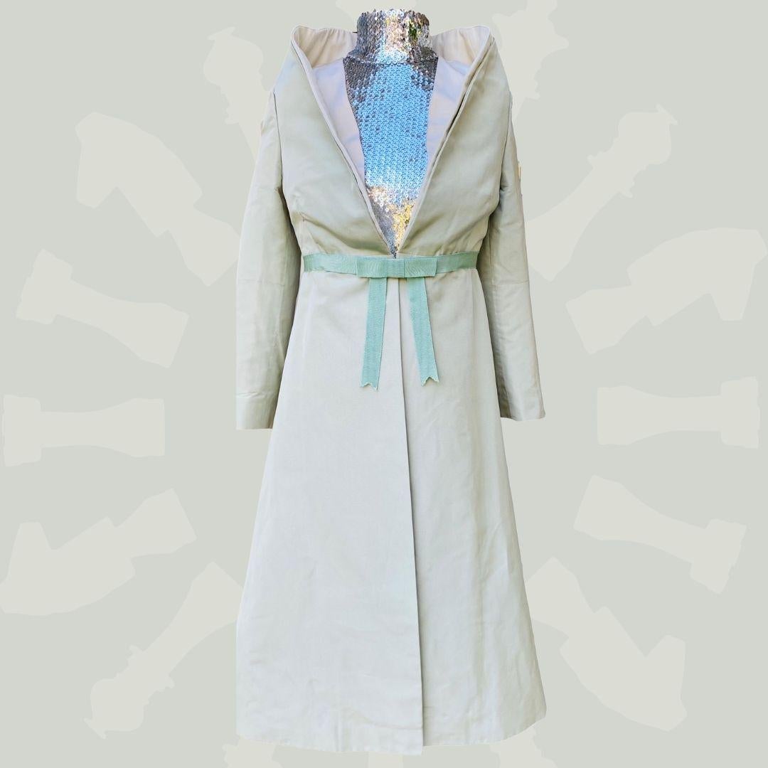 Alexander McQueen - Mint Green Structured Coat - This coat is like the lavender coat shown on the  runway from It's Only A Game collection.  This coat represents the beautiful technical construction of Alexander McQueens brilliance!   The coat was