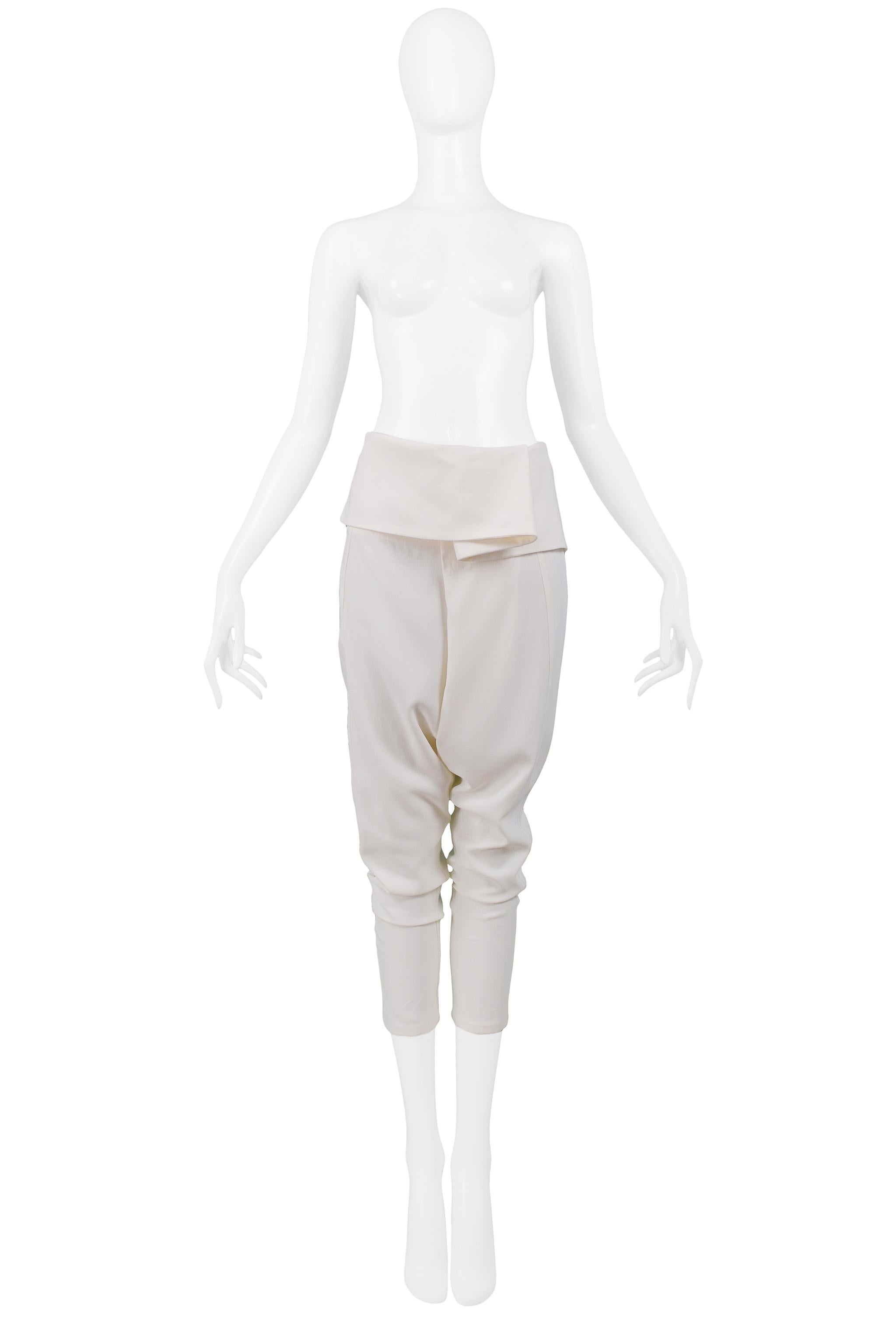 Resurrection Vintage is pleased to offer a pair of vintage Alexander McQueen off-white harem pants featuring a wide fold-over waistband, drop crotch, baggy legs, tight calves, cropped length, and center front zipper. 
Alexander McQueen Label
Size