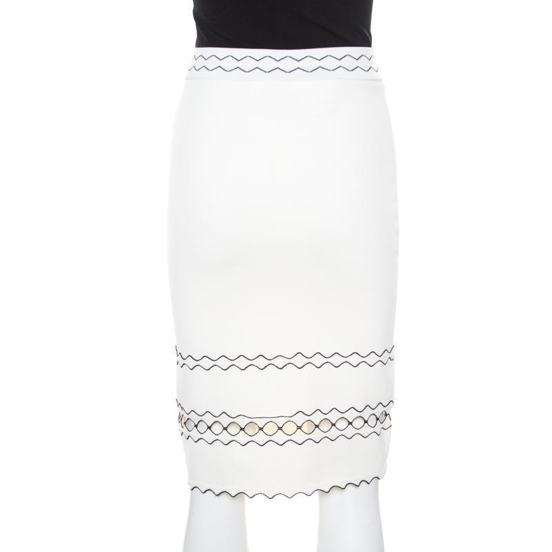Your chic and fashionable wardrobe deserves nothing less stylish than this Alexander McQueen pencil skirt! This ivory creation is made of a blend of fabrics and features a rib knit design. It flaunts a contrasting cutout hem detailing that lends it