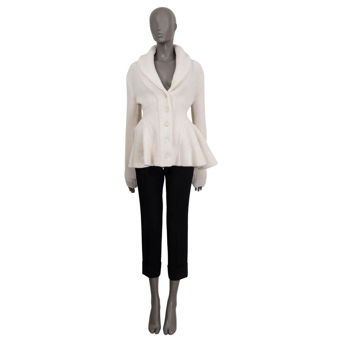 100% authentic Alexander McQueen 2021 peplum rib knit jacket in white wool (100% please note the content tag is missing). Features a shawl collar and a deep v-neck. Opens with four buttons on the front. Unlined. Has been worn and is in excellent