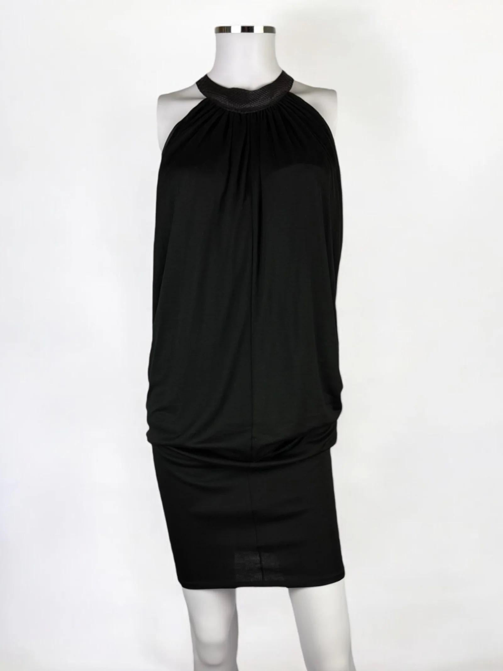 Alexander McQueen jersey viscose black dress with leather reptile effect collar, 2002
Halterneck style, fastening with a buckle at the back
Rayon viscose jersey with plenty of stretch, draping from the collar and a central seam at front and