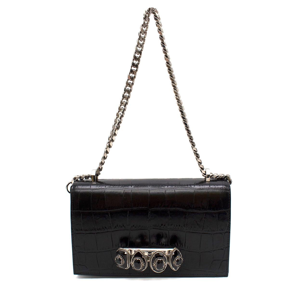 Alexander McQueen jewel handle cross-body bag

-Rich embroidery, jewel tones and ornate embellishing. 
-Crafted from croc-embossed leather. 
-Black jewel handle cross-body bag features a chain shoulder strap
-A foldover top with magnetic closure
-An