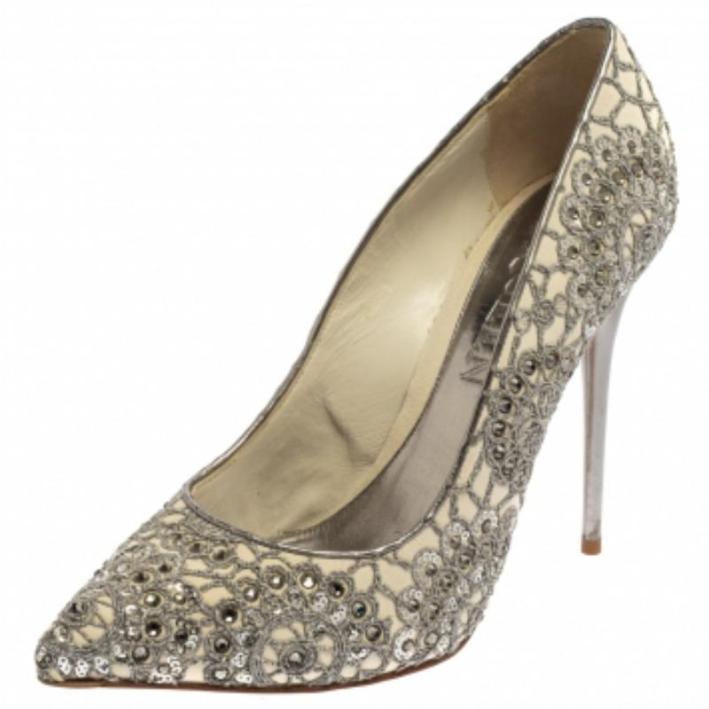 Alexander McQueen's alluring appeal comes alive in these stunning pumps. Crafted with leather, the pumps are overlaid with lace then augmented with dazzling crystals for an opulent feel. The pointed-toe silhouette is mounted on 12.5 cm stiletto