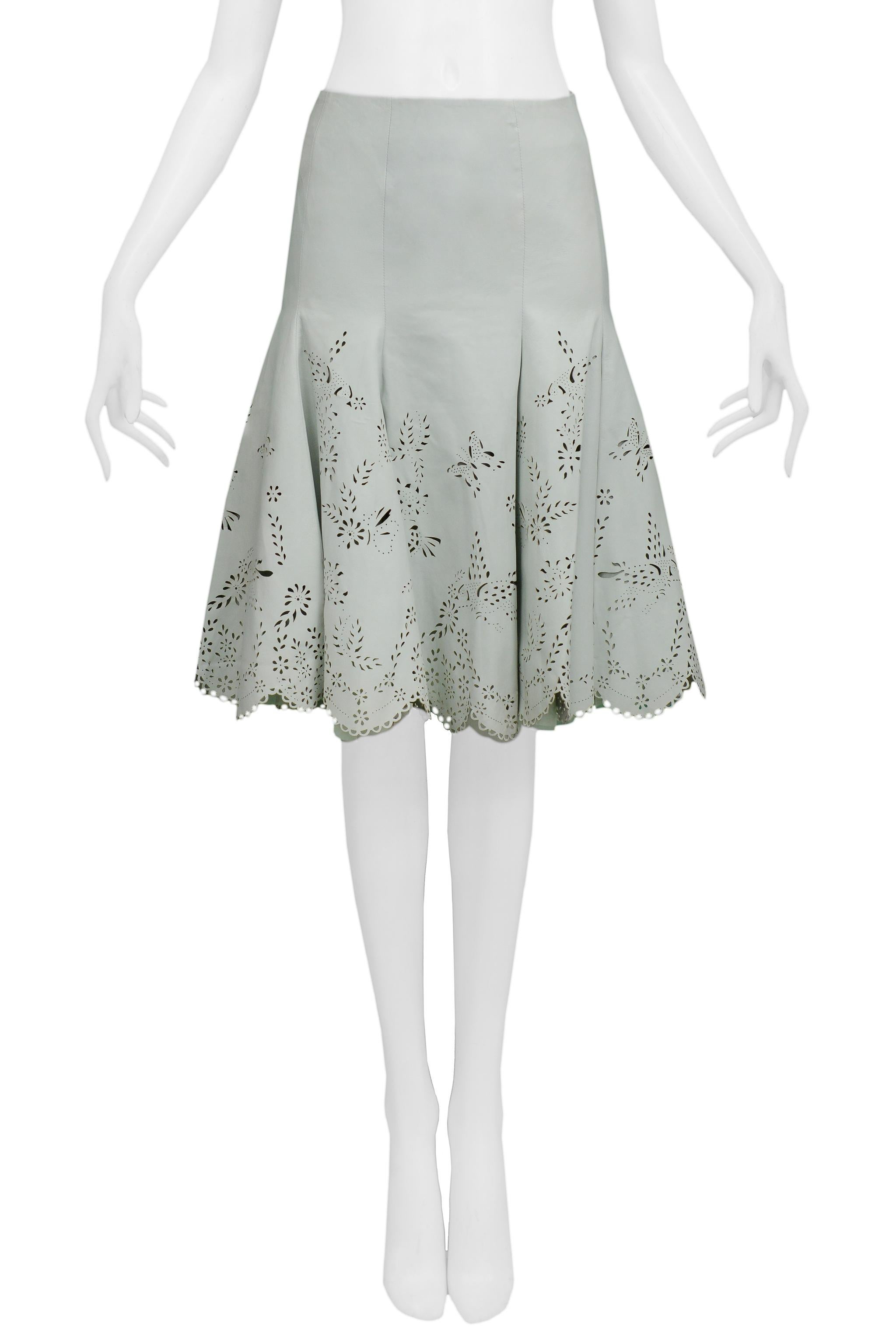 Resurrection is excited to offer a vintage Alexander McQueen light mint green leather skirt featuring laser-cut butterflies and leaves, scallop edge, and side zipper.

Alexander McQueen Label
Size 40
100% Leather
100% Silk Lining
2005 Collection