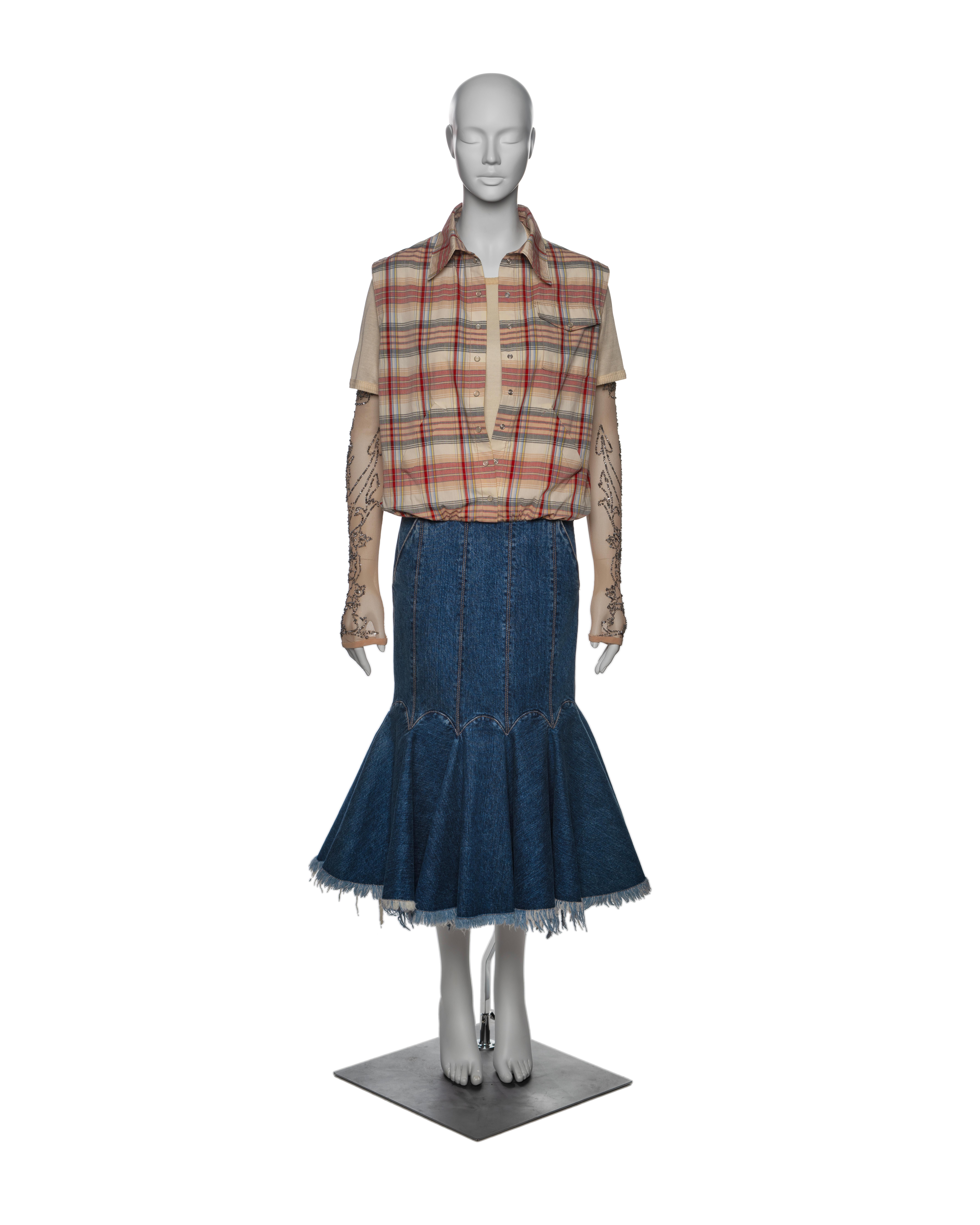This single garment mimics the look of layered pieces: a sleeveless checked shirt with mother-of-pearl buttons over a satin T-shirt with attached mesh sleeves, embroidered with silver sequins and 